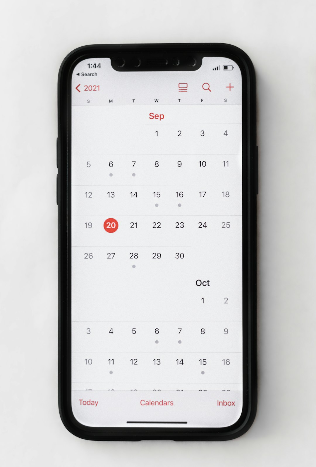 Phone showing a calendar, for booking an appointment online